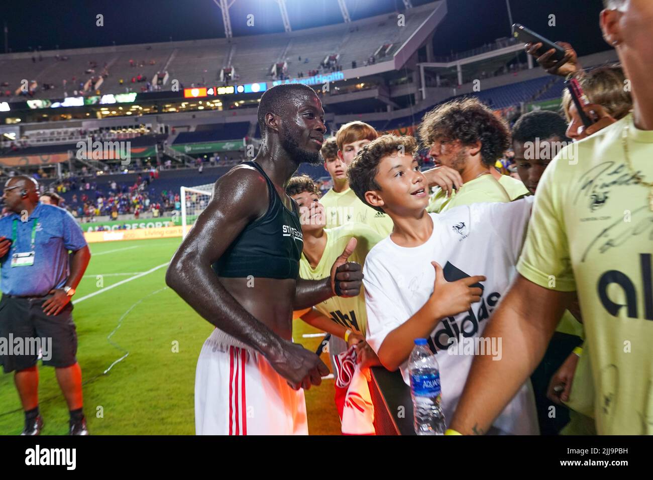 Orlando, Florida, USA, July 23, 2022, Arsenal FC player Nicolas Pepe #19  takes a selfie with a fan after a 4-0 win against Chelsea at Camping World  Stadium in a Friendly Match. (