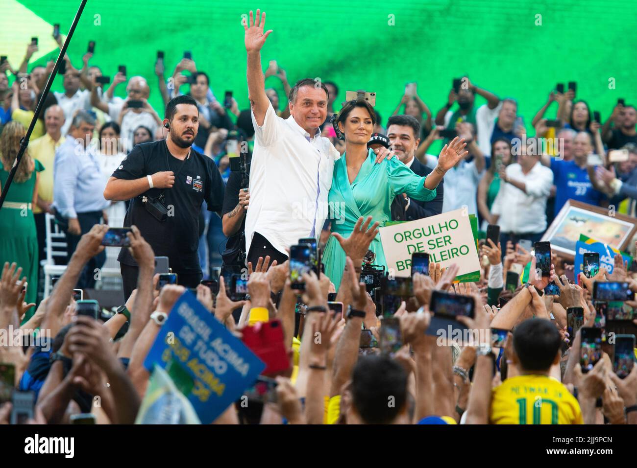 Rio De Janeiro, Brazil. 24th July, 2022. Brazilian President Jair Bolsonaro and his wife Michelle Bolsonaro stand on stage during the official campaign launch for his re-election. Brazil's general election is set for Oct. 2, 2022. Credit: Fernando Souza//dpa/Alamy Live News Stock Photo