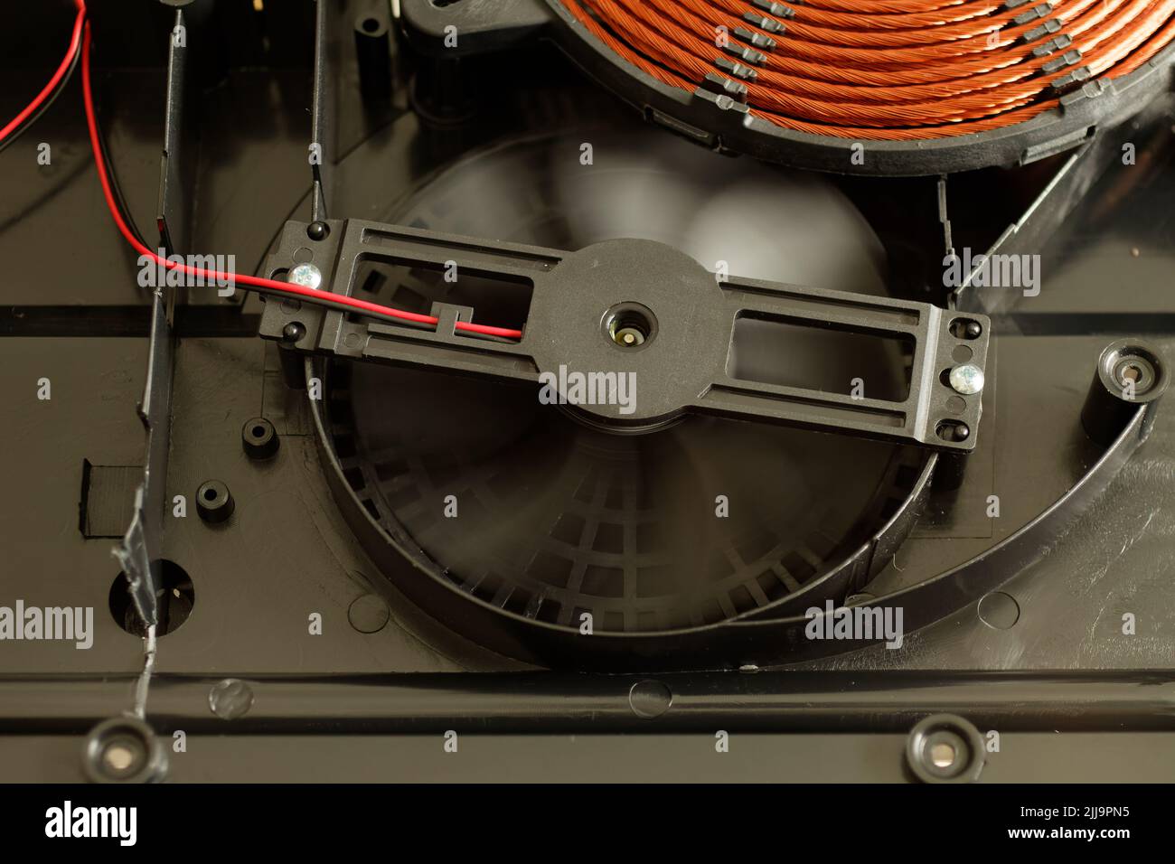 Rotating induction cooker fan, cooling the electronic and heating