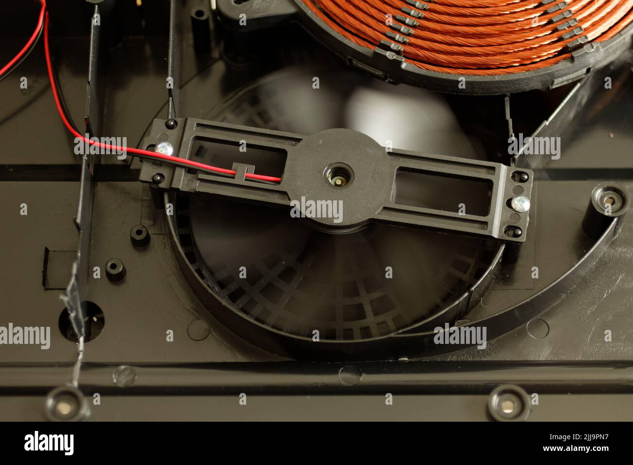 Rotating induction cooker fan, cooling the electronic and heating