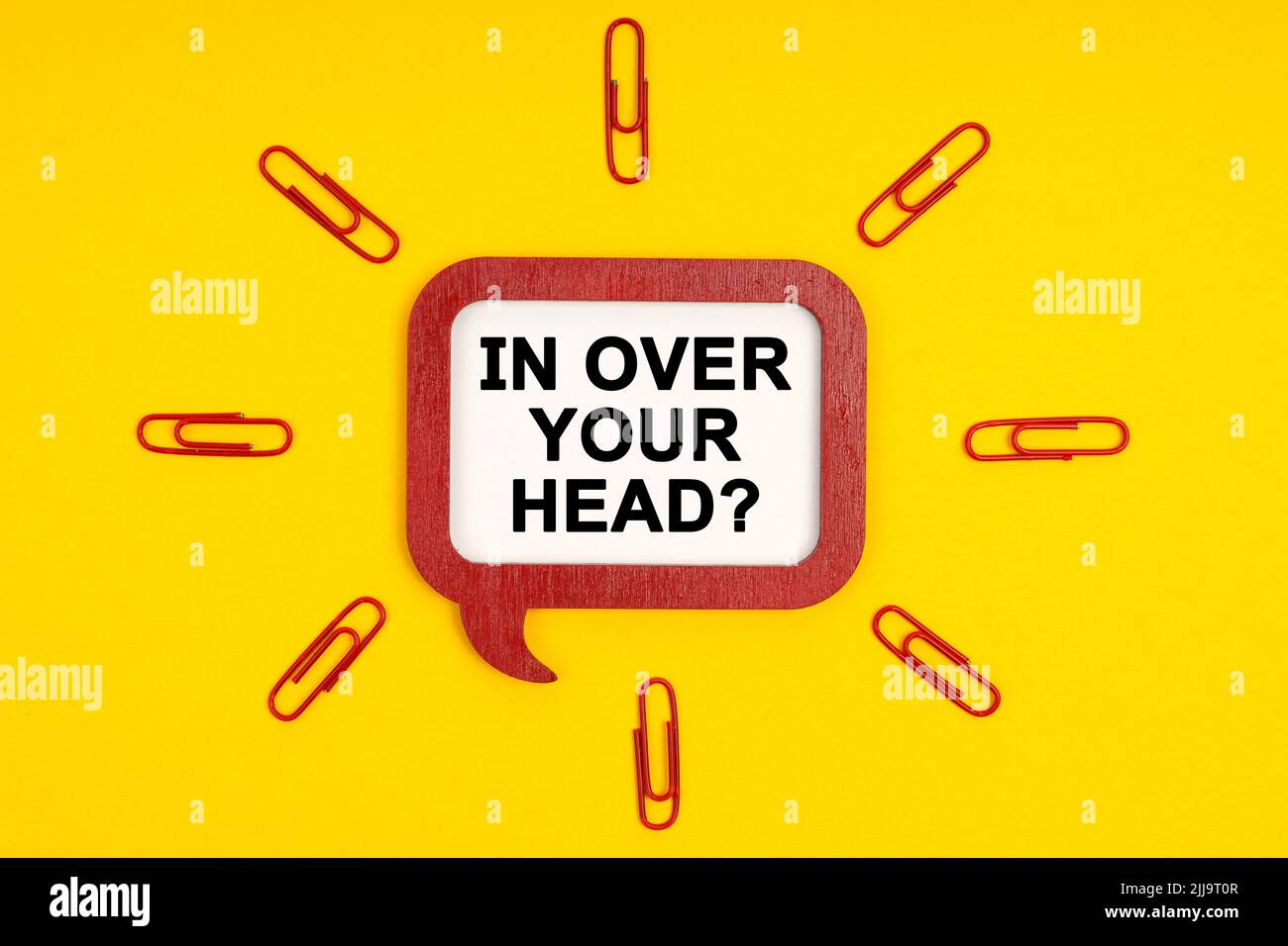 Business and people concept. On a yellow background, paper clips and a