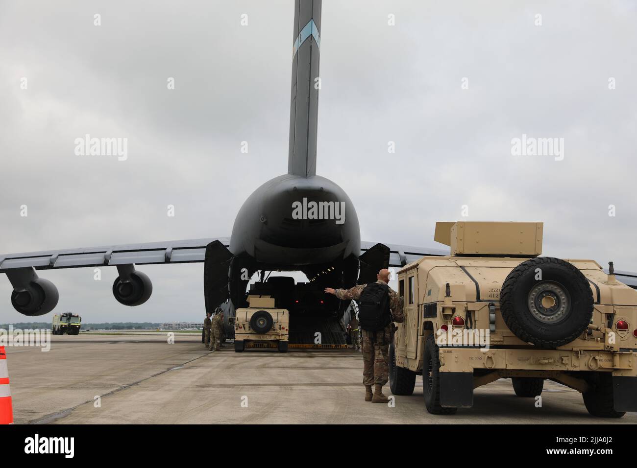 U.S. Army Soldiers of the 412th Civil Affairs Battalion, 360th Civil Affairs Brigade, are loading High Mobility Multipurpose Wheeled Vehicle HMMWV)) inside of the C-5 Galaxy departing from John Glenn Columbus International Airport on July 18, 2022. Operation Viking is an intense joint task force exercise designed to prepare Soldiers with realistic training simulating deployment of civil affairs units in direct support of a contingency operation in Africa. (U.S. Army Photo by SGT Kelson Brooks) Stock Photo