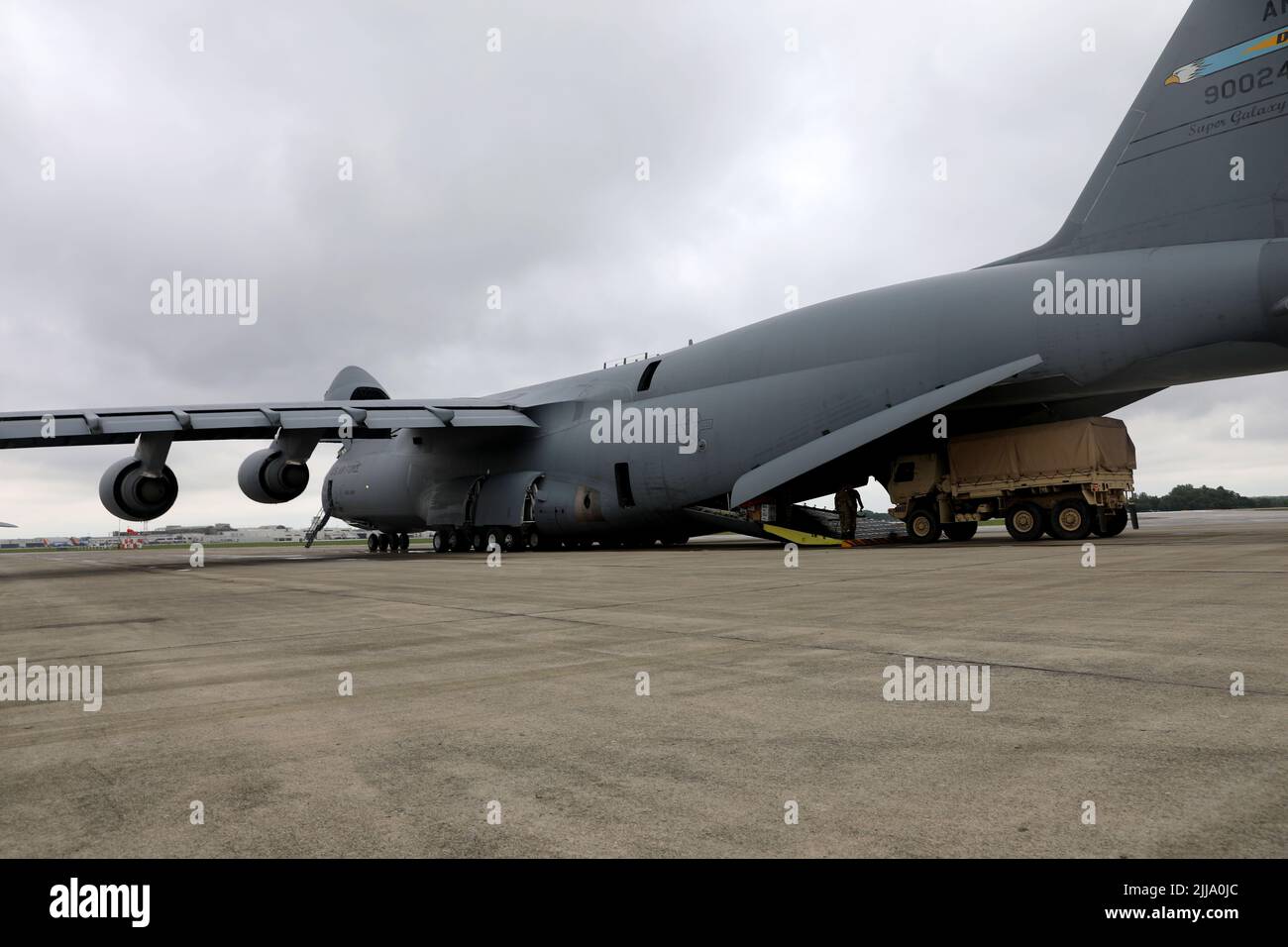 U.S. Army Soldiers of the 412th Civil Affairs Battalion, 360th Civil Affairs Brigade, are loading military vehicles inside of the C-5 Galaxy departing from John Glenn Columbus International Airport on July 18, 2022. Operation Viking is an intense joint task force exercise designed to prepare Soldiers with realistic training simulating deployment of civil affairs units in direct support of a contingency operation in Africa. (U.S. Army Photo by SGT Kelson Brooks) Stock Photo