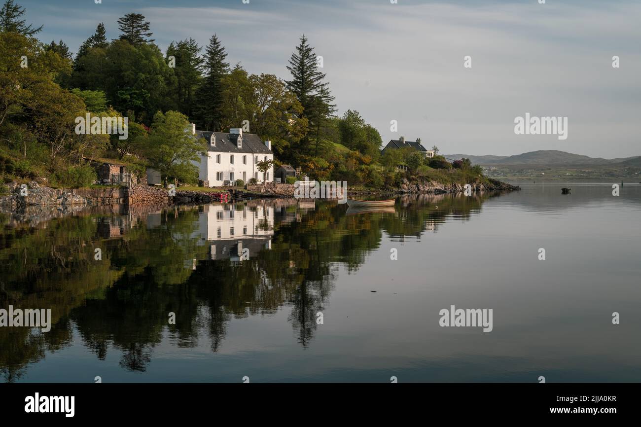 Stunning reflections on Loch Gairloch in the early morning sunshine Stock Photo