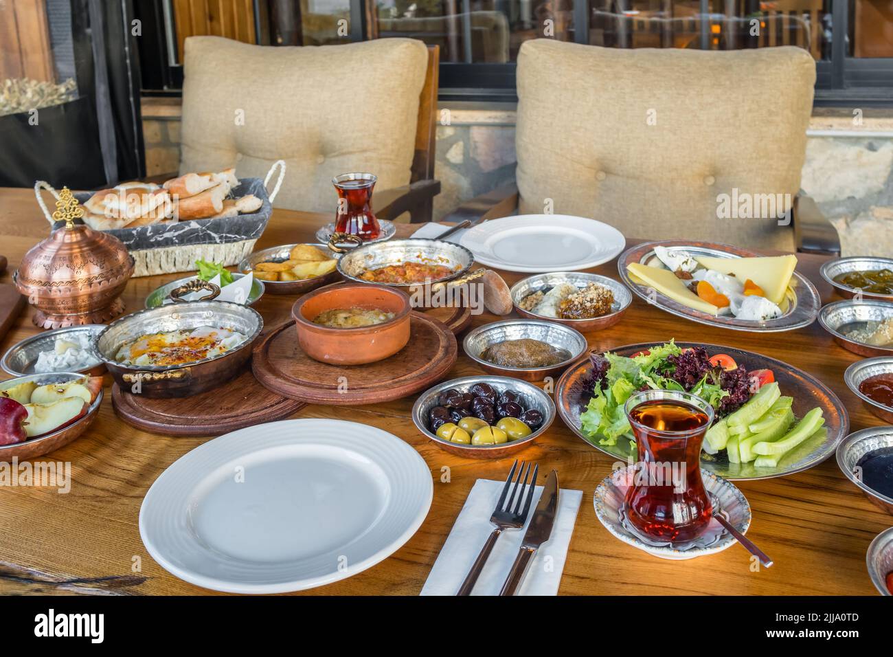 Traditional rich Turkish village breakfast on the wooden table Stock Photo