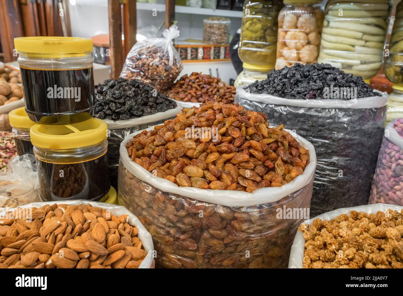 Delicious nuts and dried fruits at the traditional Turkish food market. Stock Photo