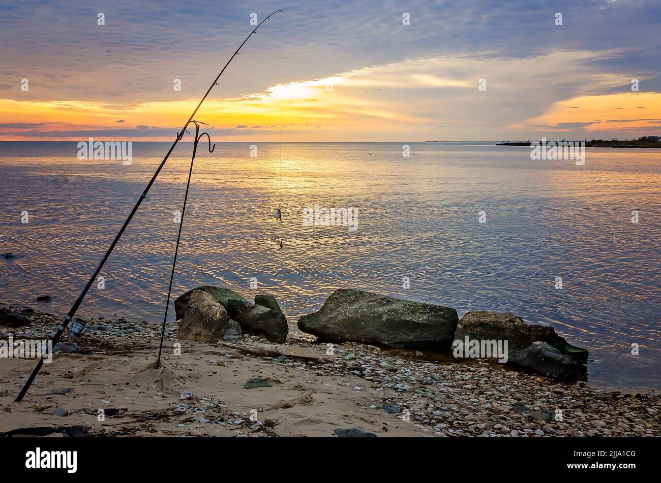Fishing pole in the sand hi-res stock photography and images - Alamy