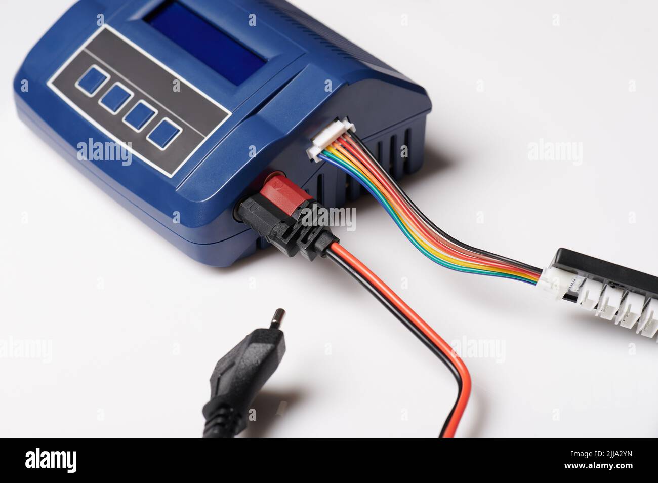 Professional charger with connect cables isolated on studio background Stock Photo