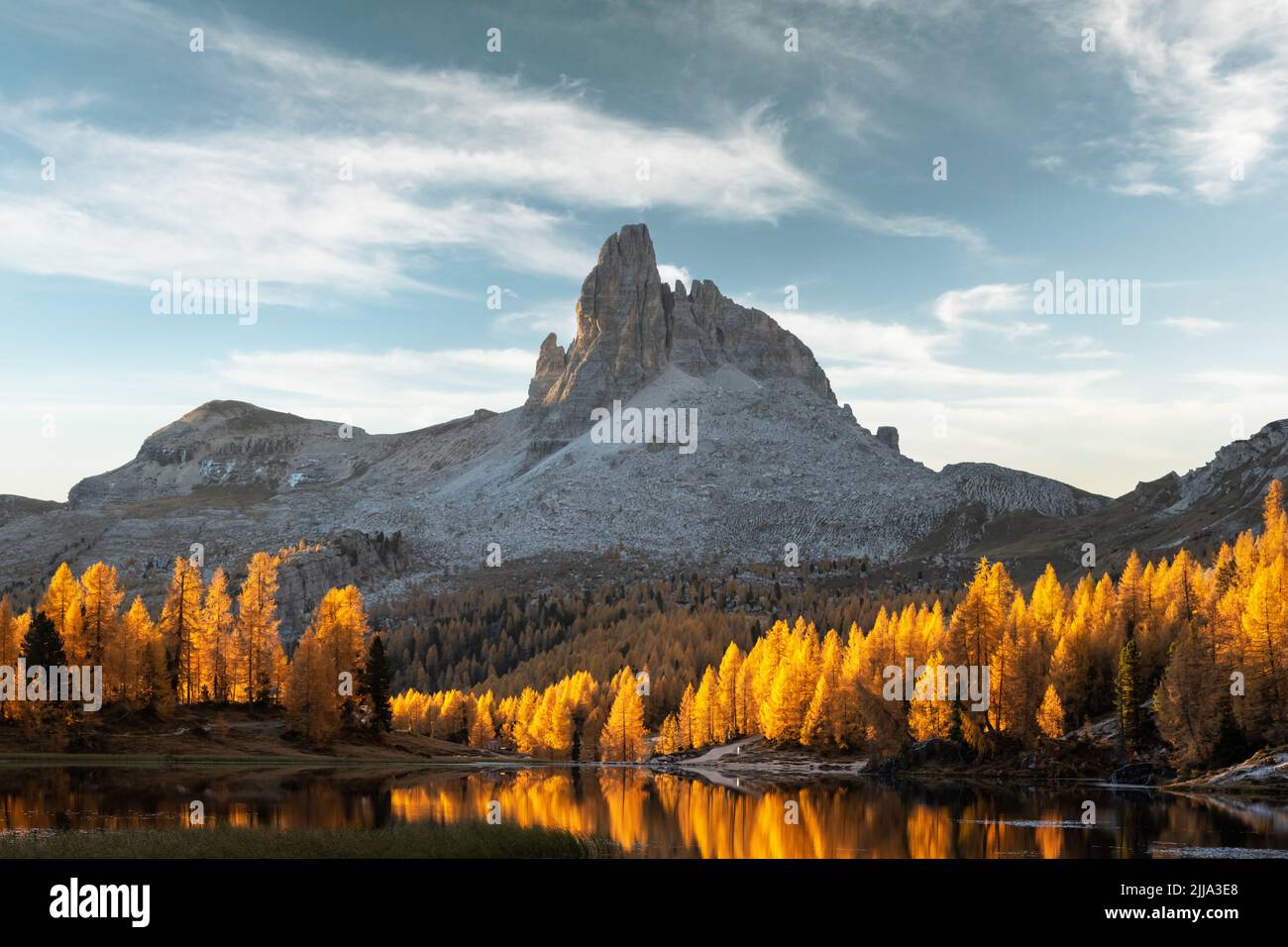 Picturesque view on Federa Lake in sunrise time. Autumn mountains landscape with Lago di Federa and bright orange larches in the Dolomite Apls, Cortina D'Ampezzo, South Tyrol, Dolomites, Italy Stock Photo