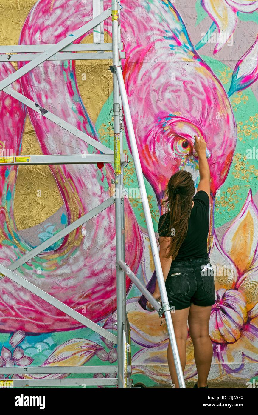 Weston-super-Mare, UK, 24 July 2022: Artist Sian Storey at work on the second day of Weston Wallz 2022. Weston Wallz is an annual event organised by Upfest, Europe’s largest street art festival, in partnership with Culture Weston and Weston-super-Mare Town Council. Stock Photo