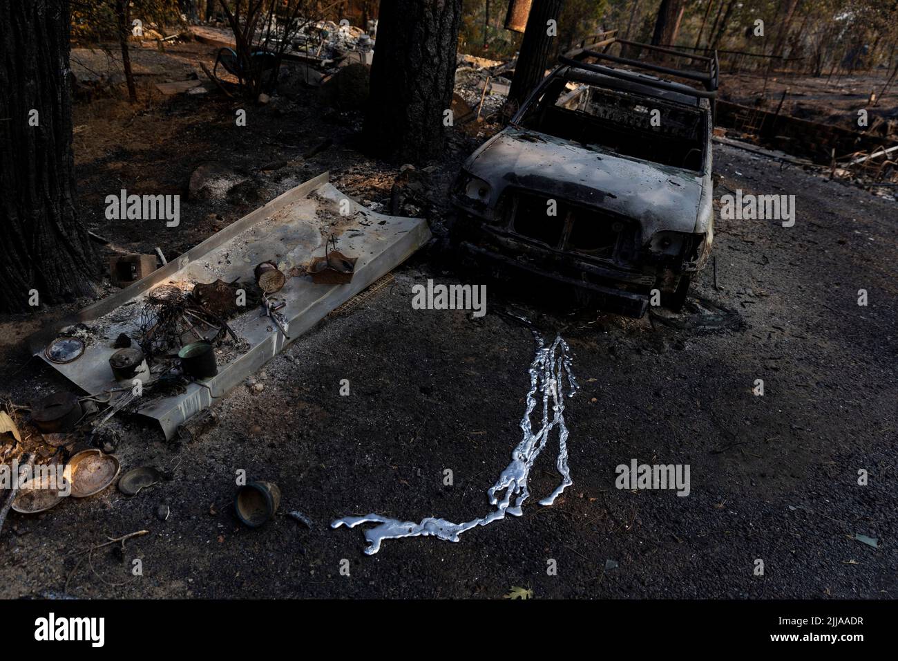 Melted metal from a burned vehicle is seen as the Oak Fire burns areas near Darrah in Mariposa County, California, U.S., July 24, 2022. REUTERS/Carlos Barria Stock Photo