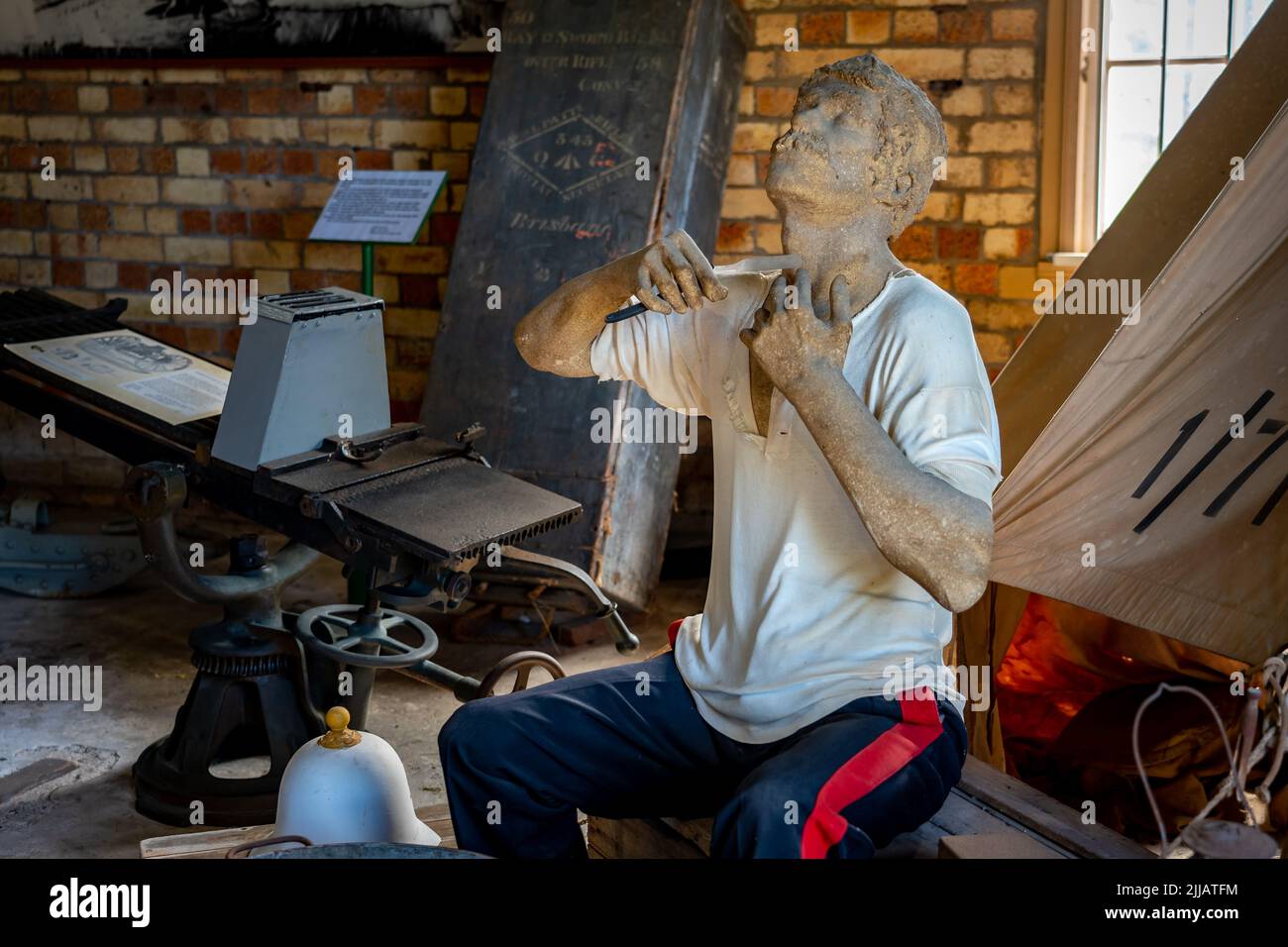 Brisbane, Australia - Sculpture of a man shaving with a razor blade at the Fort Lytton museum Stock Photo