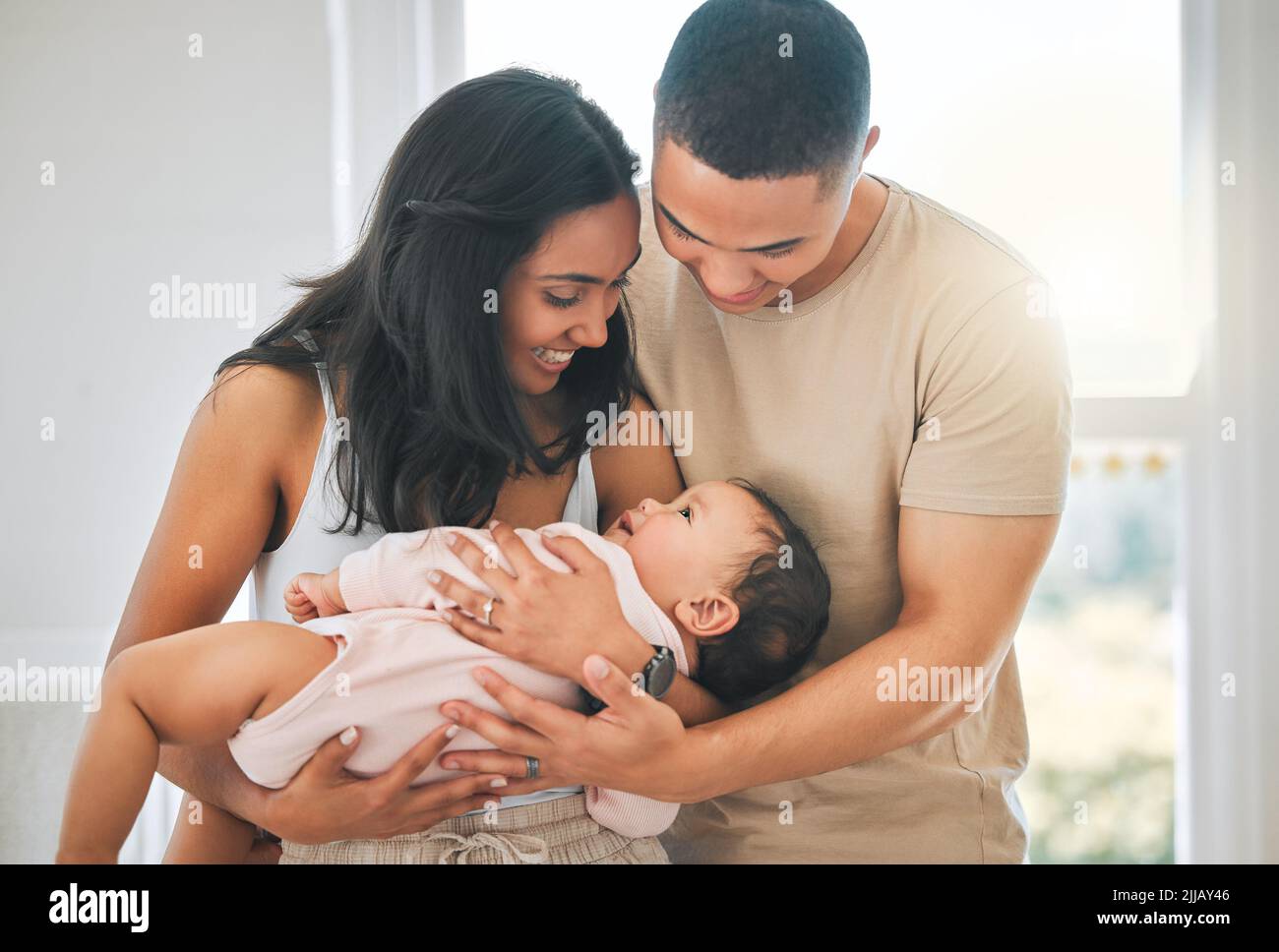 Their own little family. an affectionate young couple and their newborn baby at home. Stock Photo