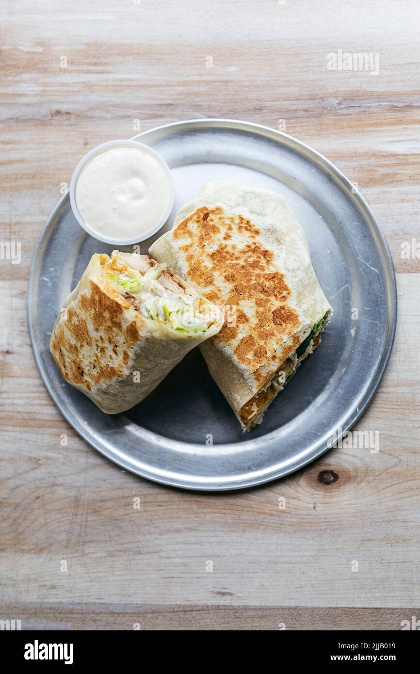 Chicken wrap with romaine lettuce, parmesan cheese, croutons and