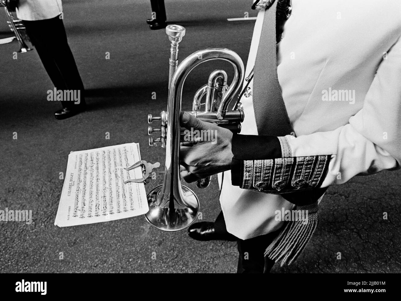 Military bandsman/musician with  trumpet and sheet music for 'The Colonel Bogey March'. at the 1980 annual Anzac Day march in Sydney April 25, 1980 Stock Photo