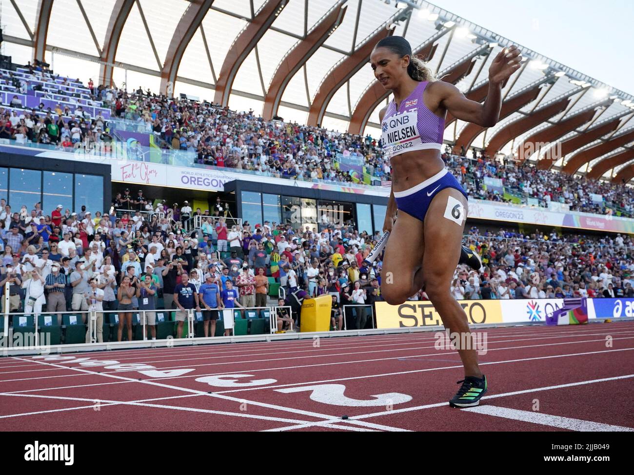 Athletics - World Athletics Championships - Women's 4x400 Metres Relay - Final - Hayward Field, Eugene, Oregon, U.S. - July 24, 2022 Britain's Laviai Nielsen crosses the line to finish the women's 4x400 metres final in third place REUTERS/Lucy Nicholson Stock Photo