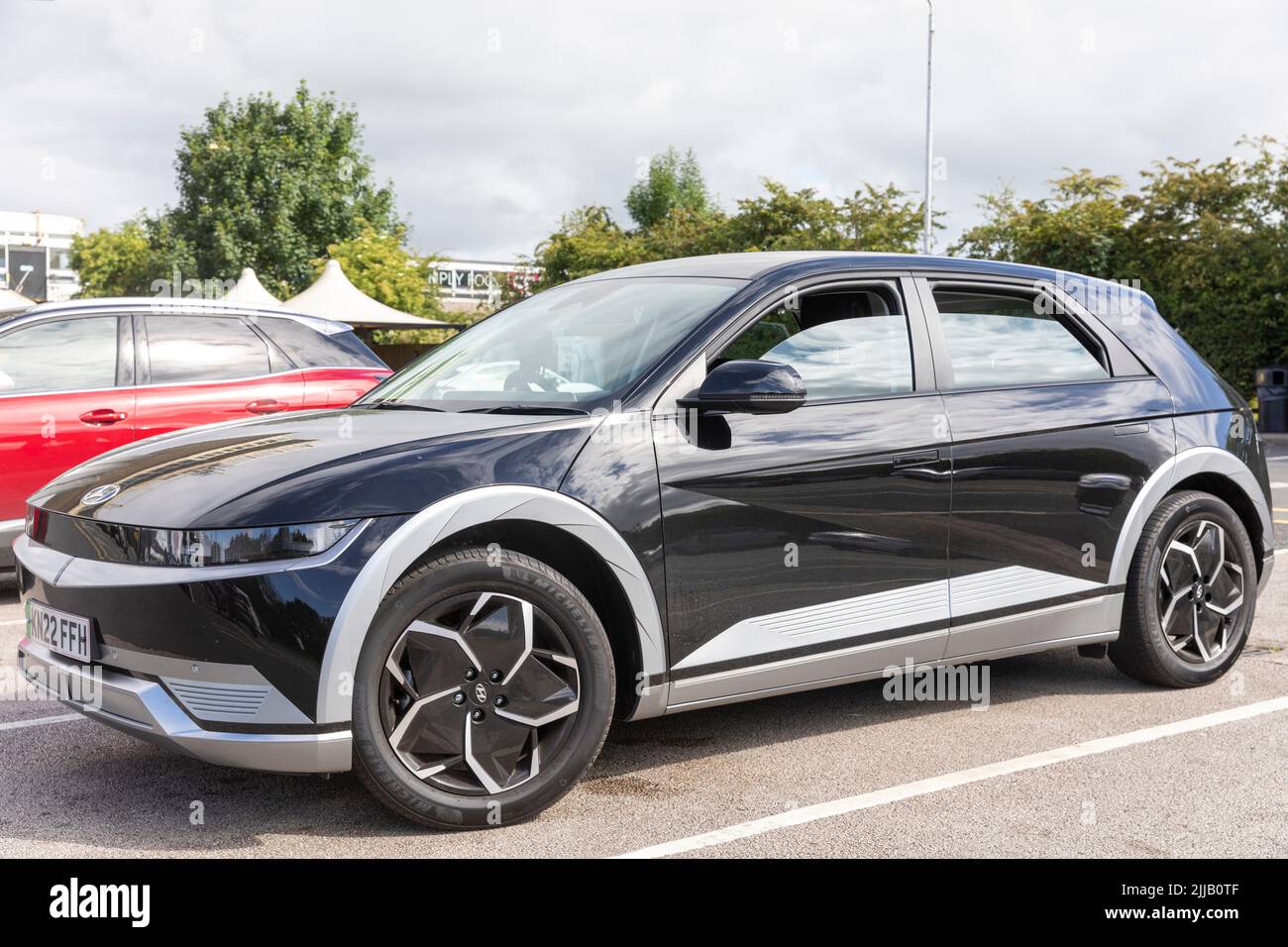 Hyundai Ioniq 5 electric car parked at a motorway service station in England, UK, this is a mid sized SUV made by Hyundai Stock Photo