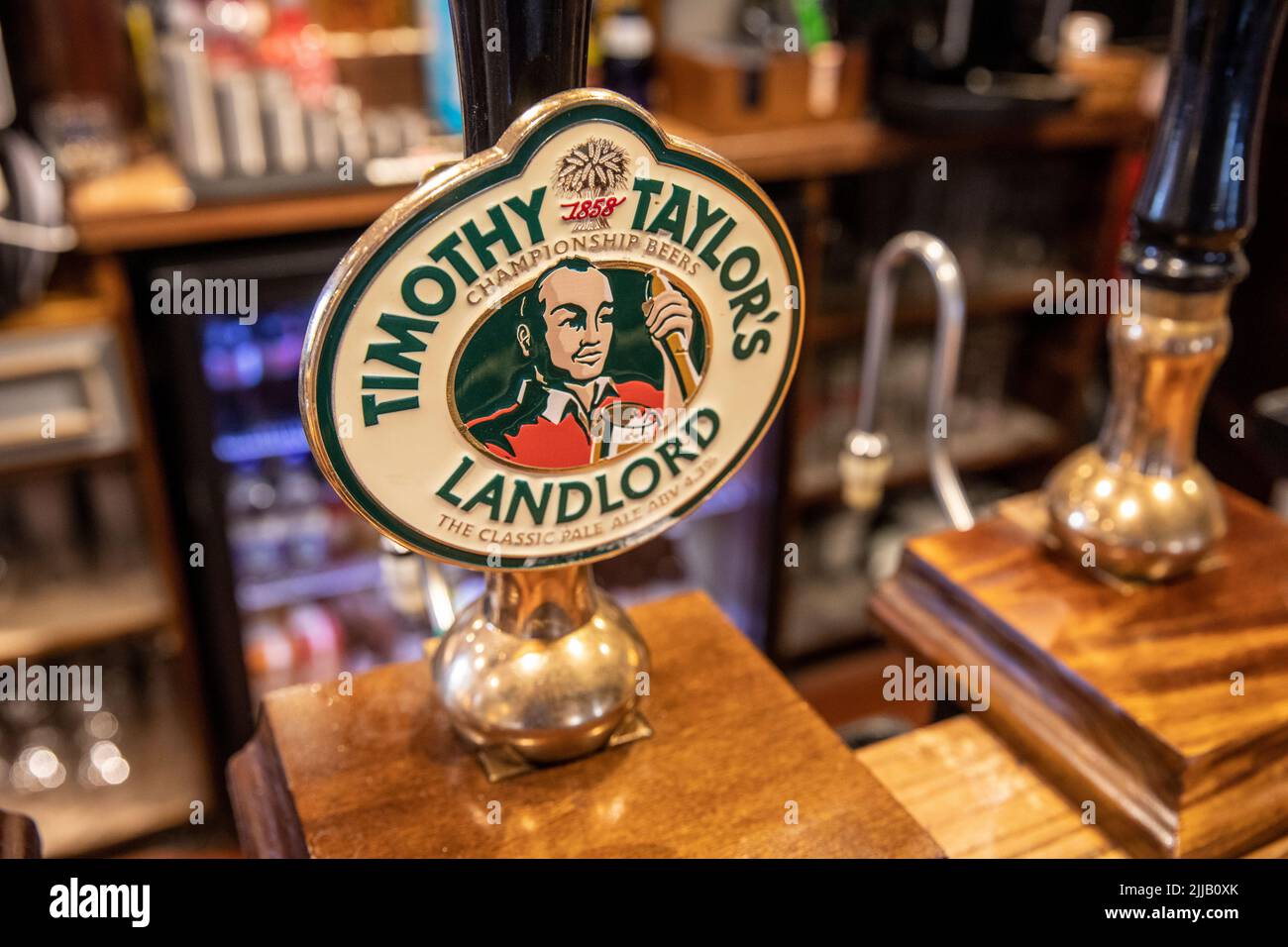 Timothy Taylors landlord Championship beer, hand pump in a Lancashire public house, England,UK Stock Photo