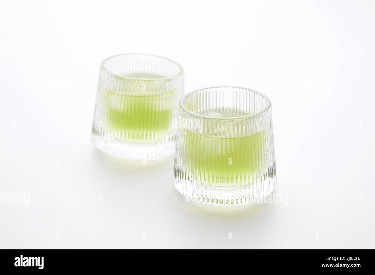 glass of cold green tea drink isolated on white background Stock Photo