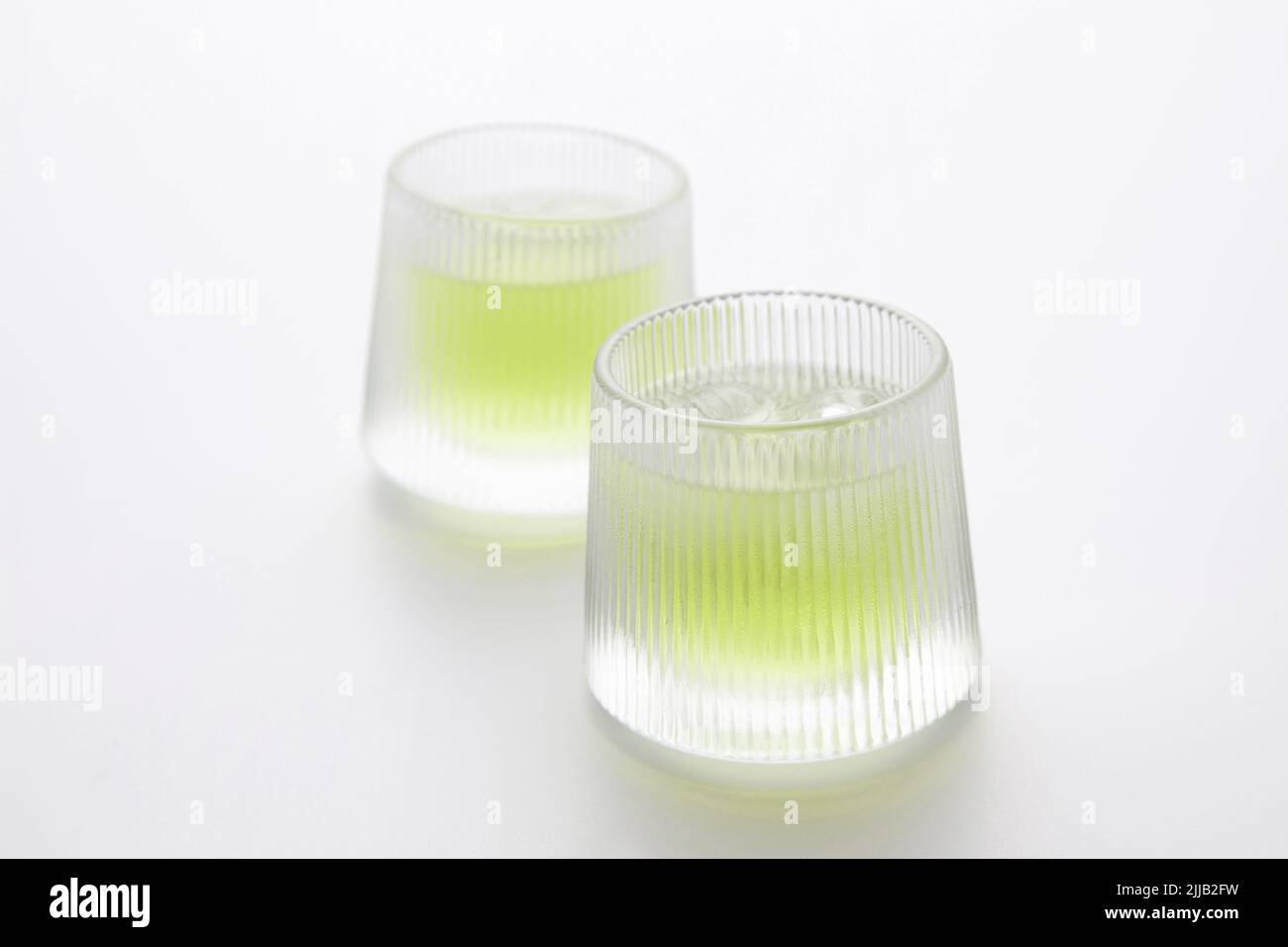 glass of cold green tea drink isolated on white background Stock Photo