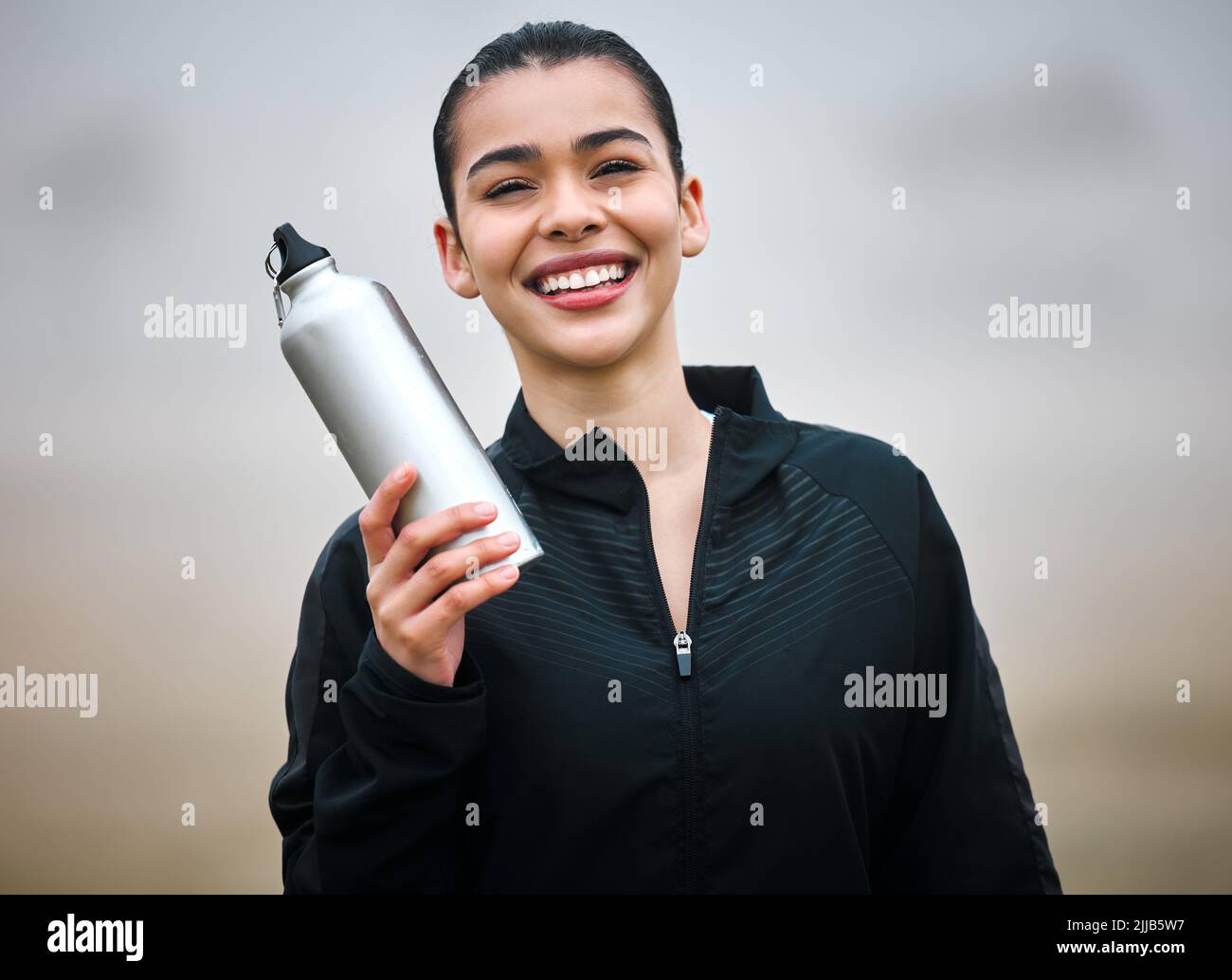 Stay hydrated. Cropped portrait of an attractive young female athlete