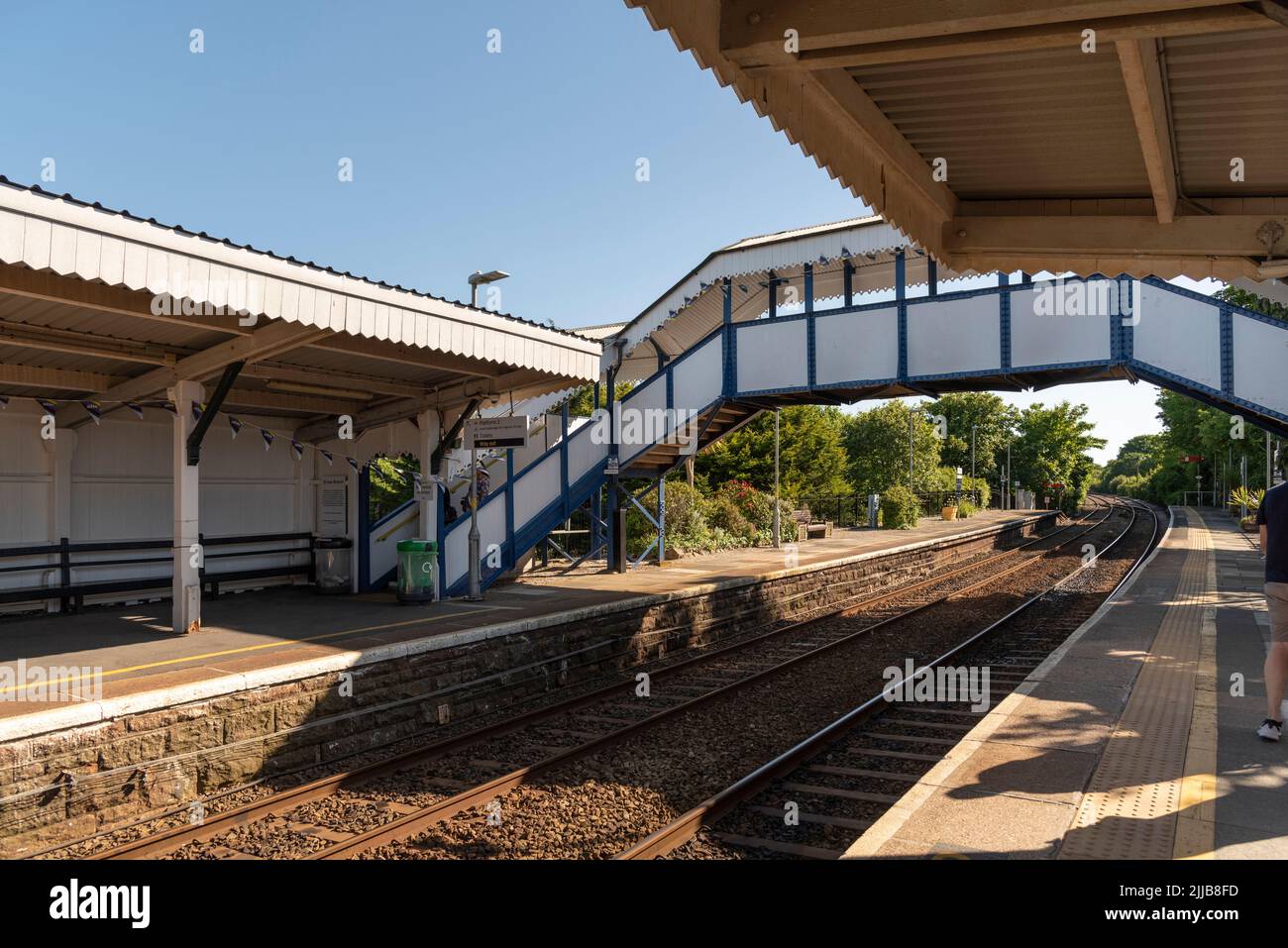 St Erth, Cornwall, England, UK. 2022. St Erth station platforms and footbridge. Change station for the popular coastal branch line to St Ives a holida Stock Photo