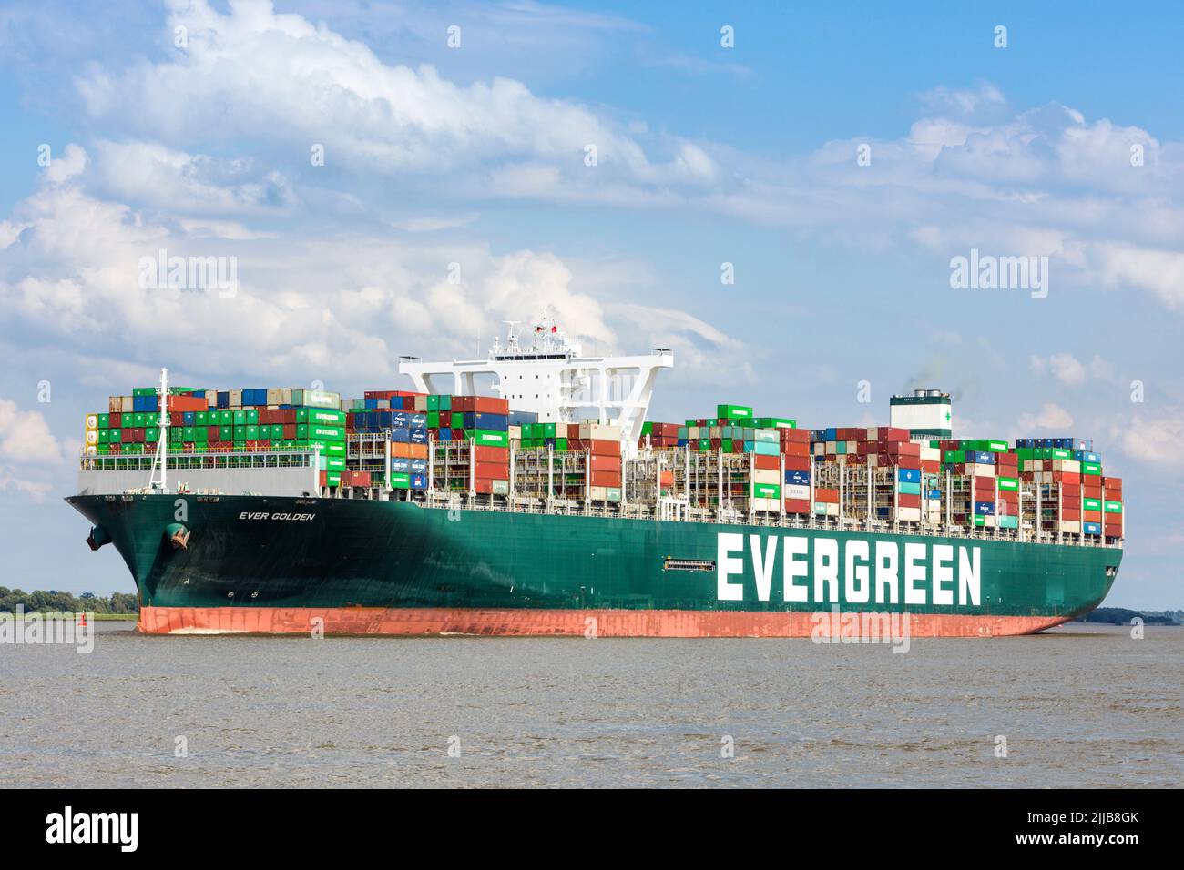 Stade, Germany – July 4, 2022:  Container ship EVER GOLDEN on Elbe river after her visit to Hamburg. Stock Photo