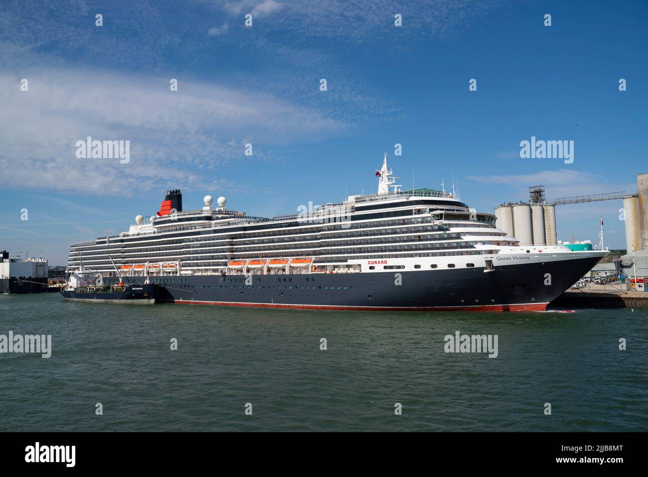 The MS Queen Victoria, a Vista-class cruise ship operated by Cunard, docked in Southampton Docks harbourside. Stock Photo