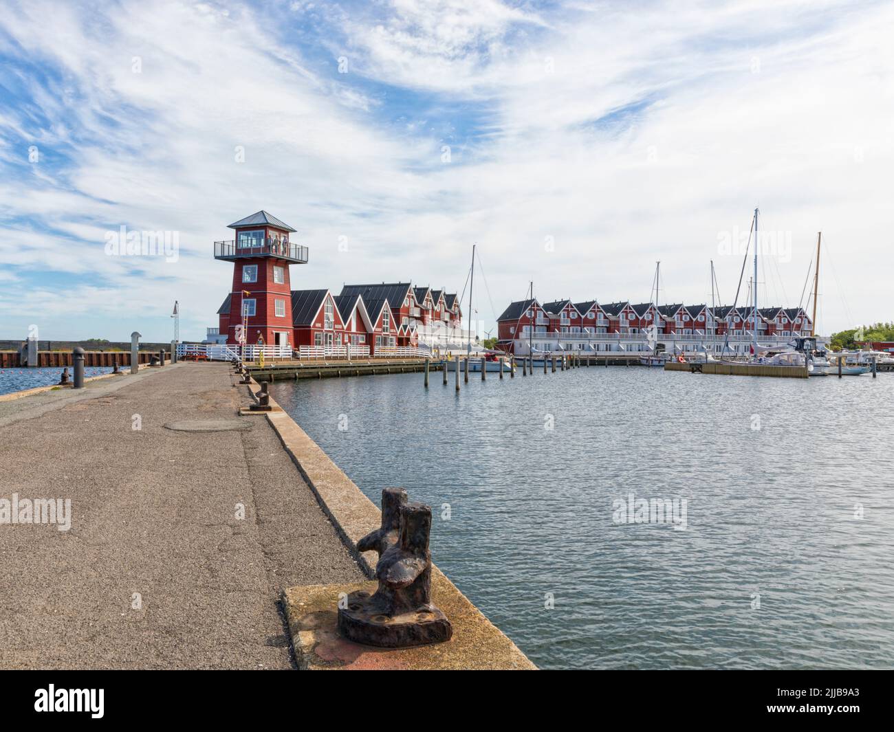 Commercial buildings, summer houses and and lookout tower at the harbor of Bagenkop, Langeland, Denmark. Stock Photo