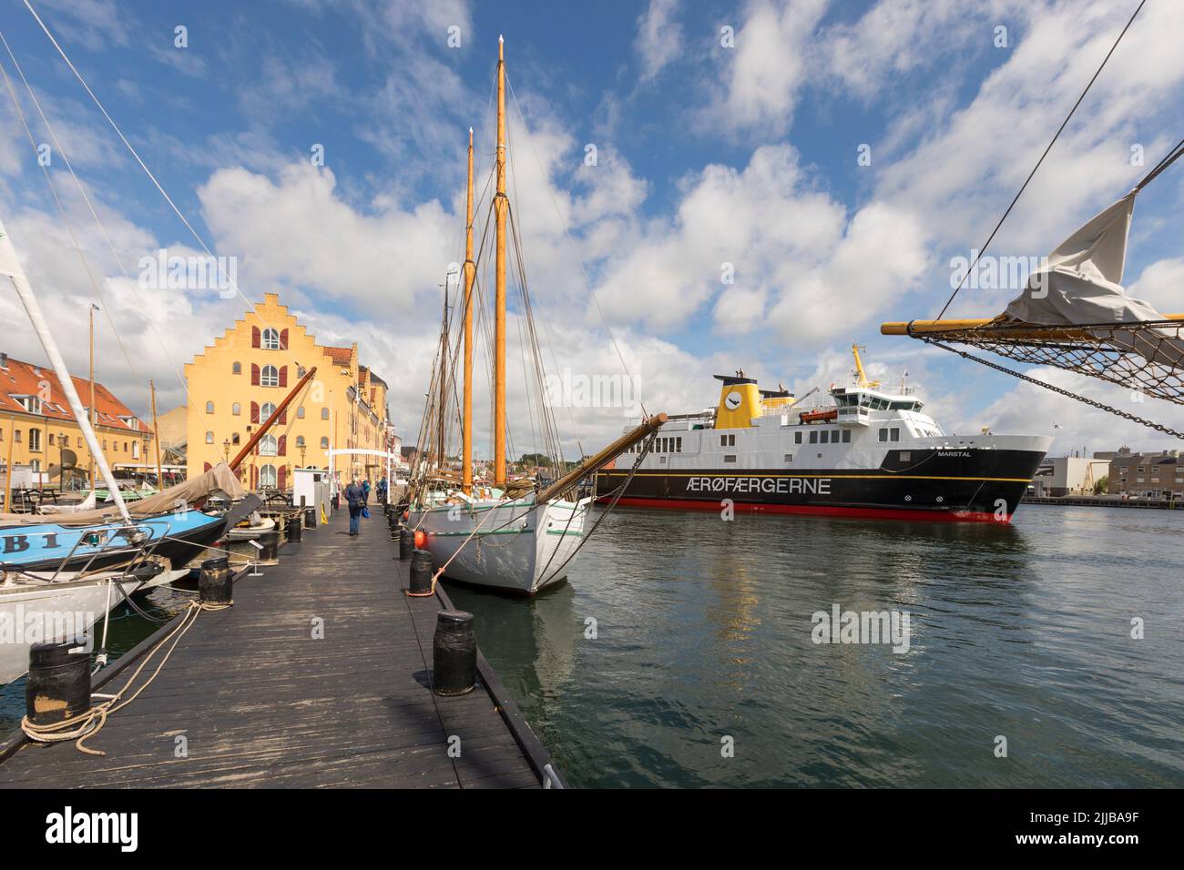 Harbor of Svendborg, Denmark, with historic sailboats and ferry to Ærø Stock Photo