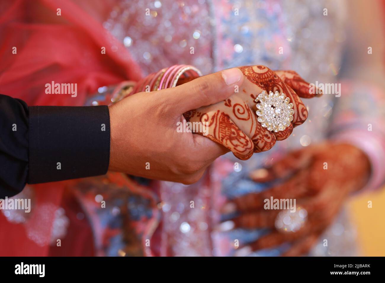 Pakistani bride and groom, close-up of hands Stock Photo