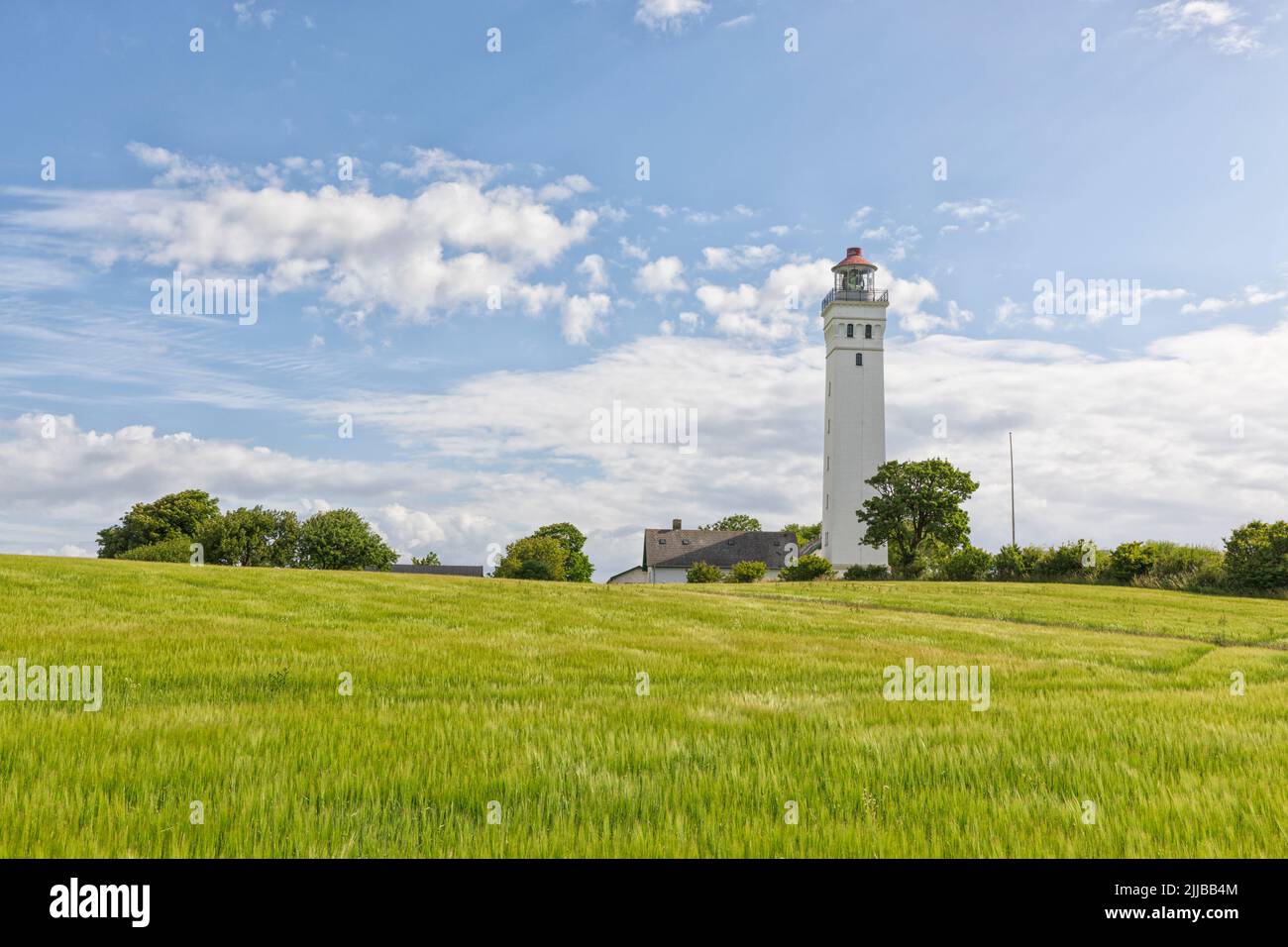 Keldsnor Fyr, lighthouse surrounded by green fields at the southern tip of Langeland, Denmark. Stock Photo