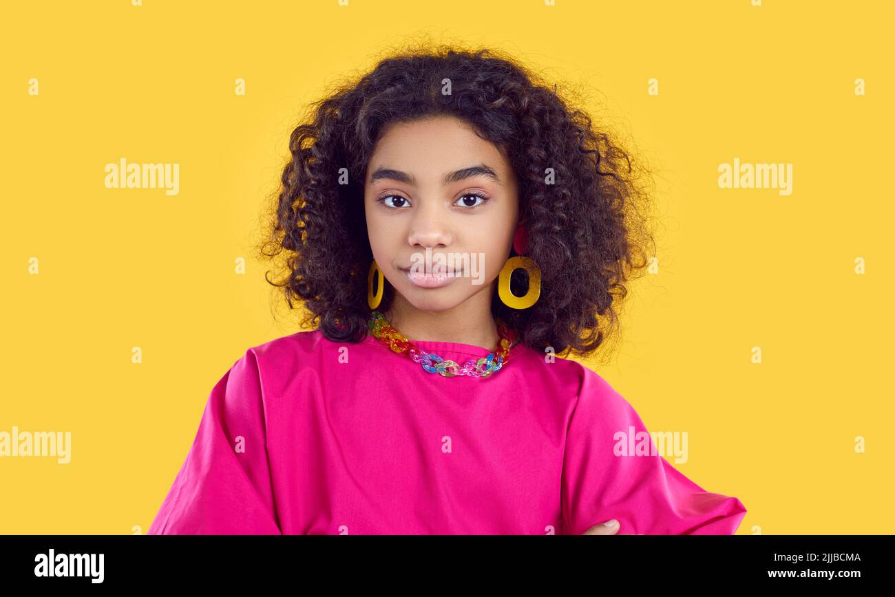 Headshot portrait of beautiful confident African American girl in fashion studio Stock Photo