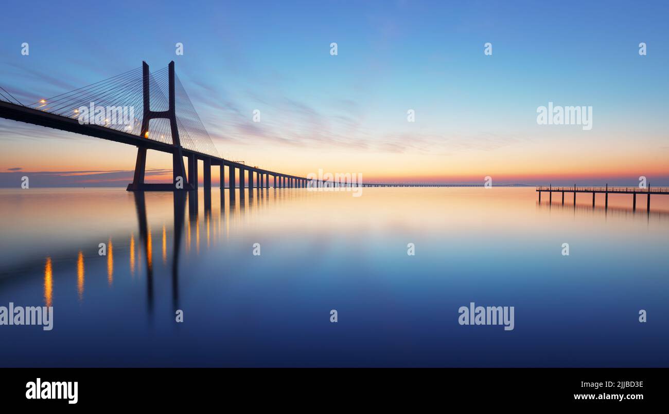 Lisbon bridge - Vasco da Gama at sunrise, Portugal Stock Photo