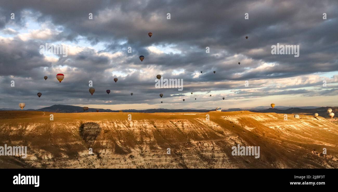 hot air balloons in flight at dawn near goreme. Turkey. Stock Photo