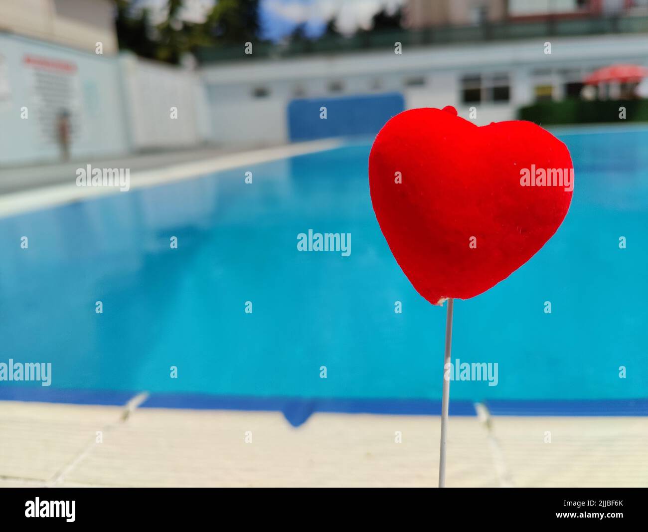 Picture of wet red heart by the pool. Valentine's Day love heart nature ...
