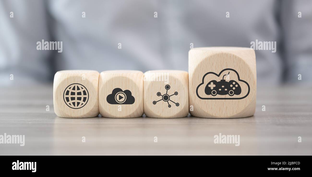 Wooden blocks with symbol of cloud gaming concept Stock Photo
