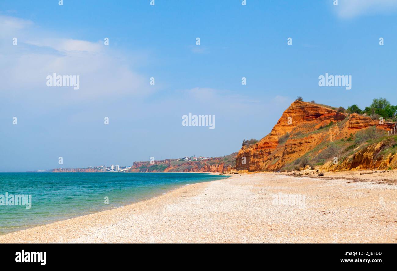 Lyubimovka beach coastal view with red cliffs. Summer landscape, Black Sea coast, Crimea Stock Photo