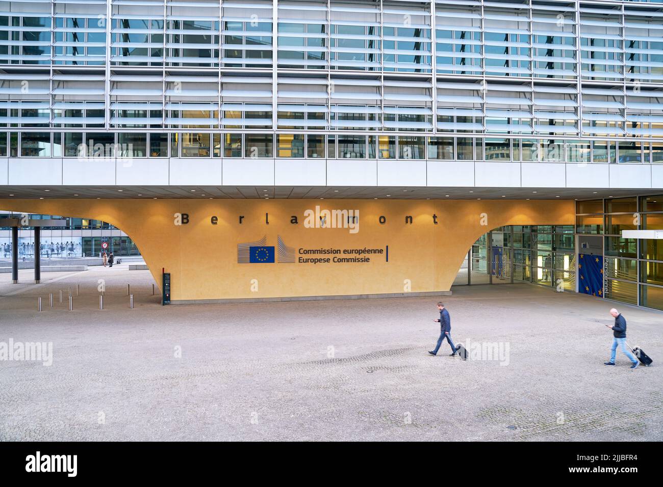 People walking in front of the Berlaymont building, headquarters of the European Commission. Stock Photo