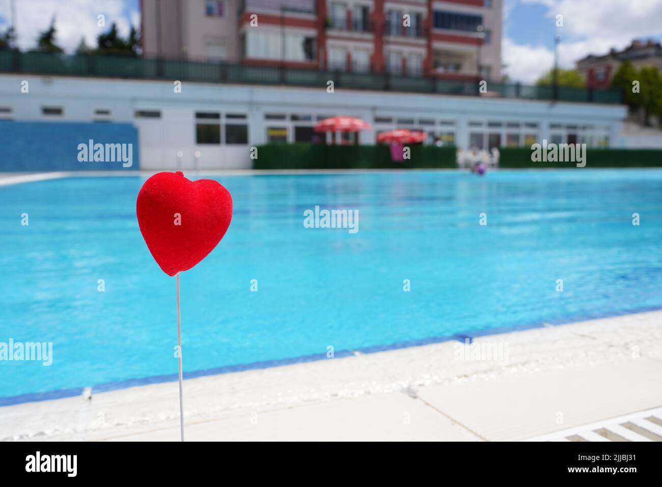Picture of wet red heart by the pool. Valentine's Day love heart nature ...
