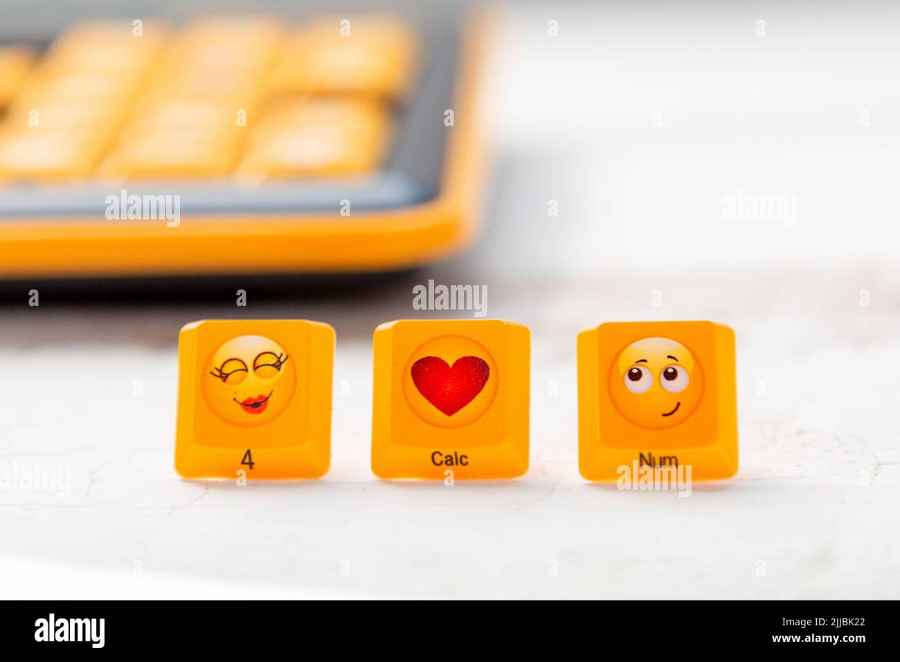 Three buttons with the image of a kiss, heart and embarrassment