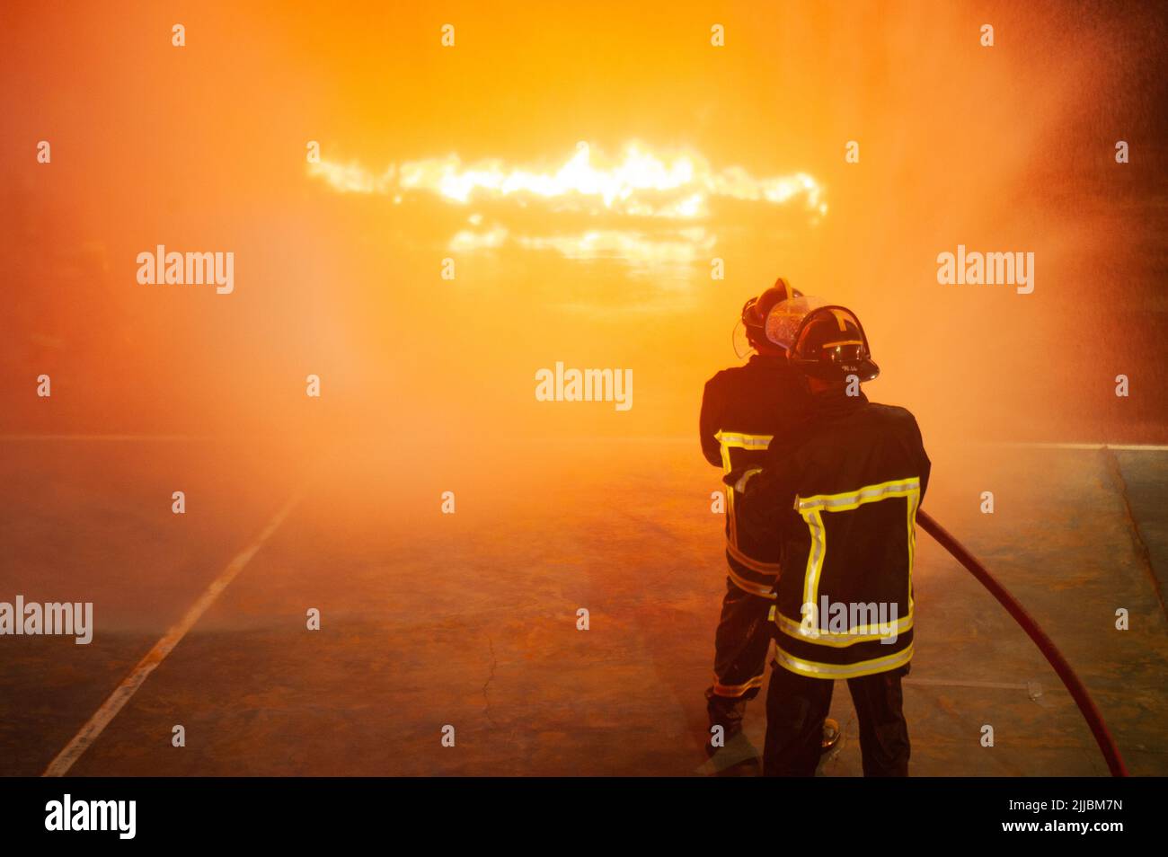 Firefighters put out fires using large cylinders to spray water. which