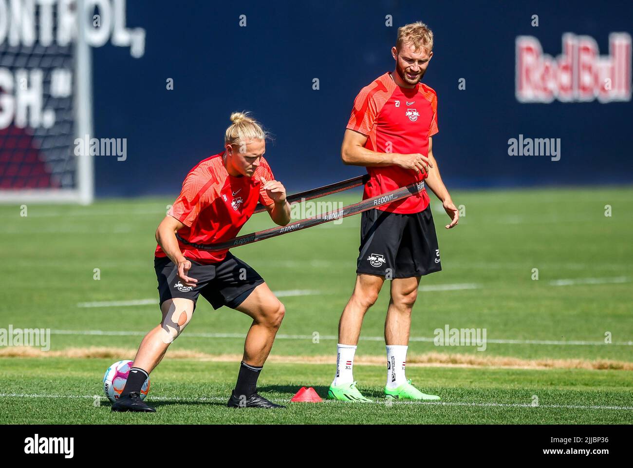 Leipzig, Germany. 25th July, 2022. Soccer: Bundesliga,ö ffentliches Training RB Leipzig before the Supercup in the training center. Leipzig's Xaver Schlager (l) and Konrad Laimer practice together. Credit: Jan Woitas/dpa - IMPORTANT NOTE: In accordance with the requirements of the DFL Deutsche Fußball Liga and the DFB Deutscher Fußball-Bund, it is prohibited to use or have used photographs taken in the stadium and/or of the match in the form of sequence pictures and/or video-like photo series./dpa/Alamy Live News Stock Photo