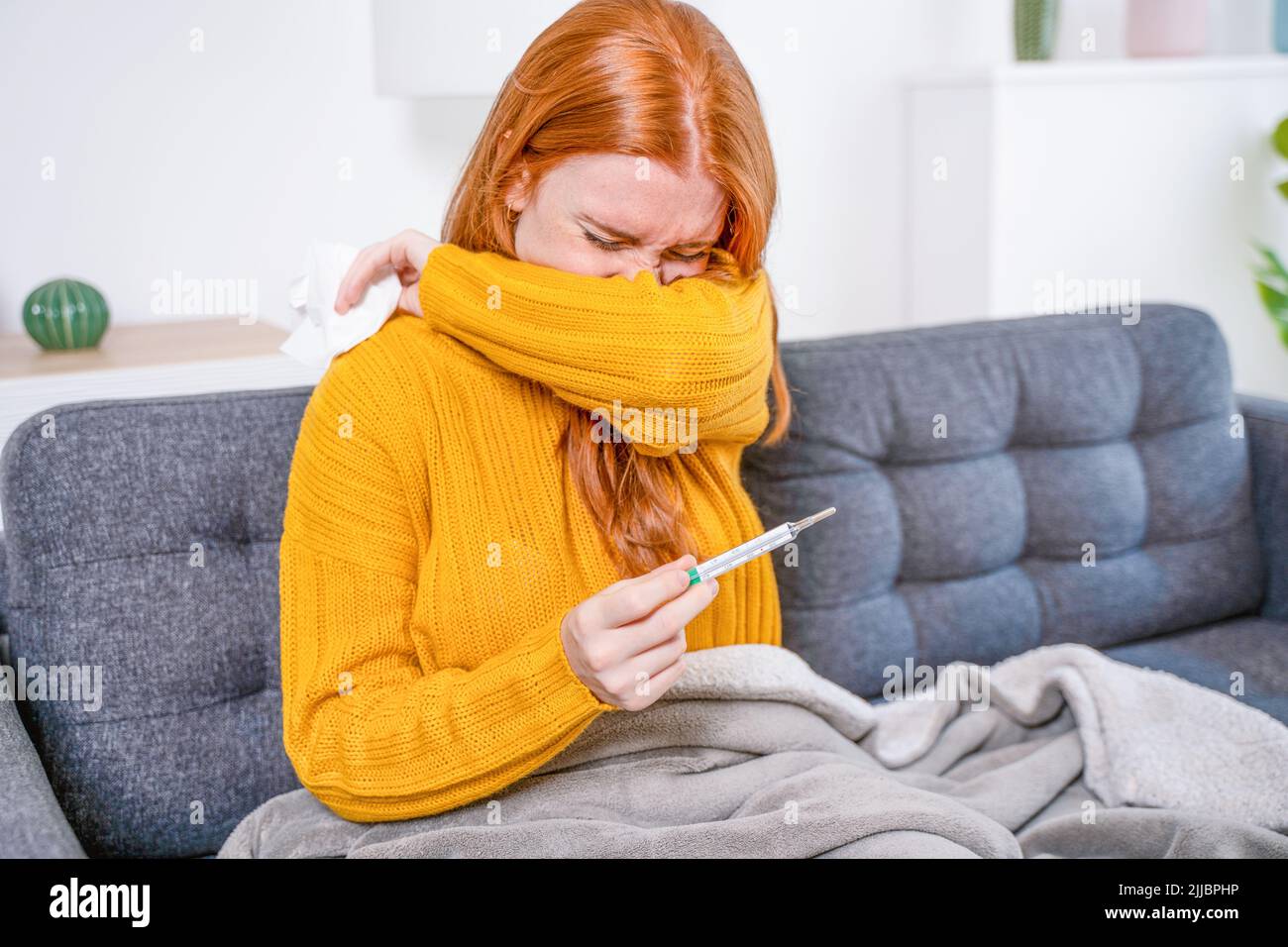 Ill woman suffering flu symptoms at home Stock Photo