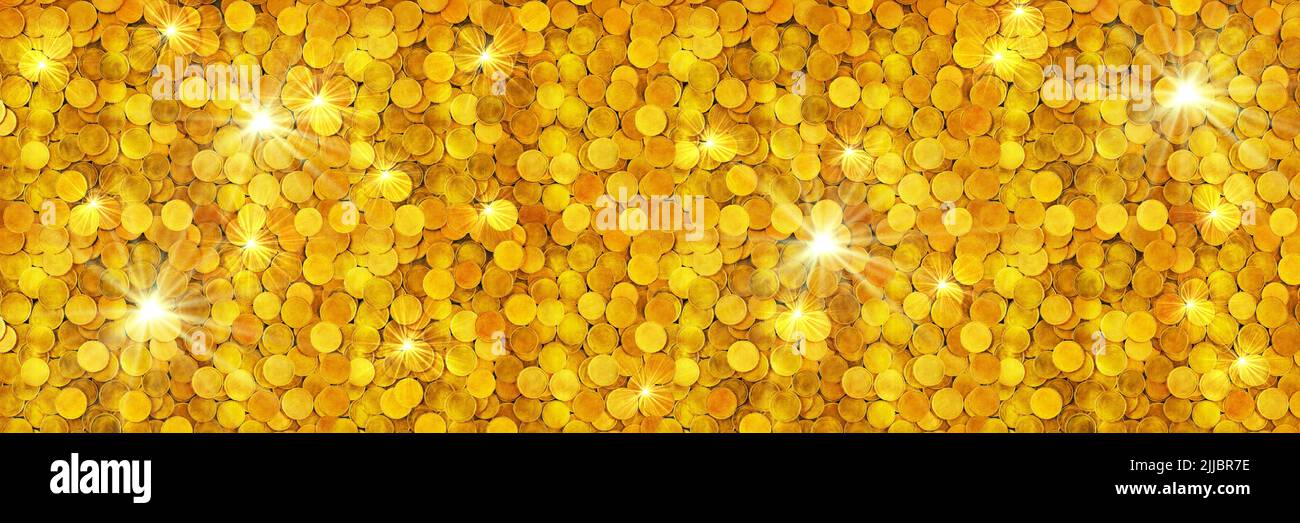 A pile of glittering gold coins. Business or finance concept panoramic banner background. Stock Photo
