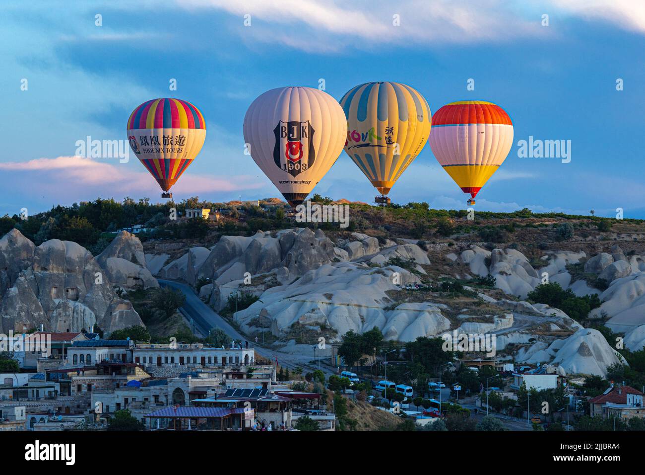 GOREME/TURKEY - June 27, 2022: hot air balloons fly over the city of goreme. Turkey. Stock Photo