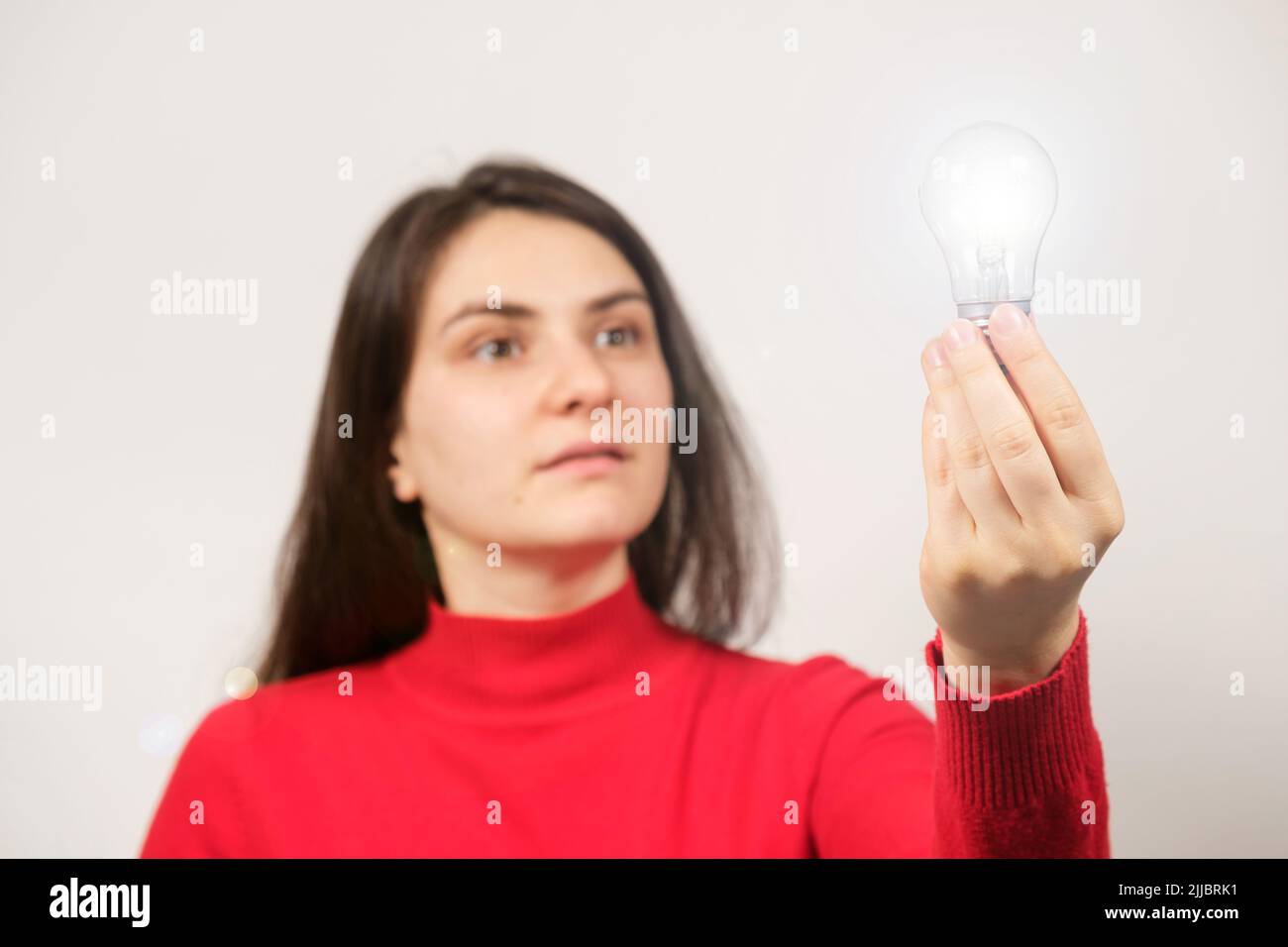 A surprised woman with her mouth open in red looks at a