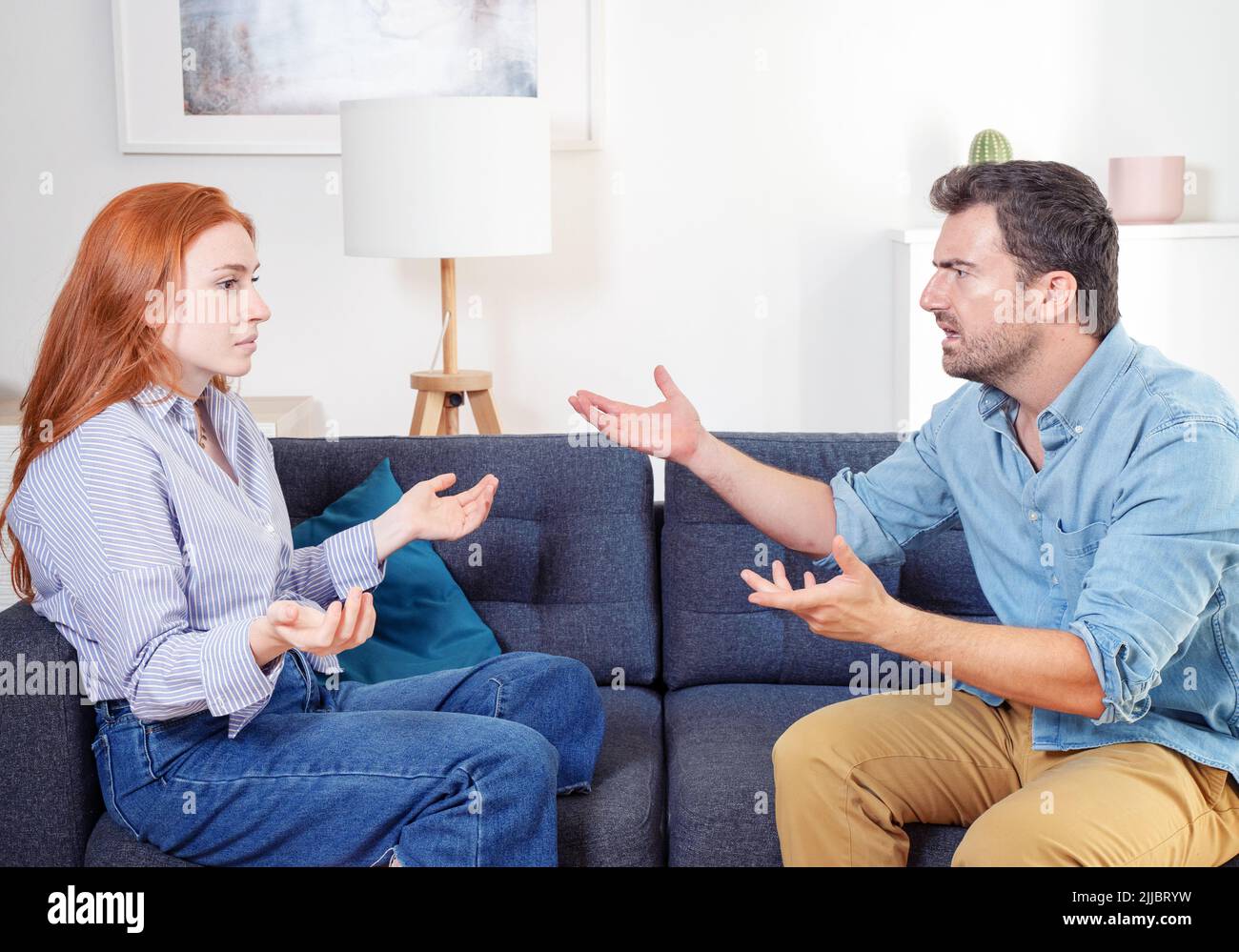 Angry couple arguing and difficulties in relationship Stock Photo
