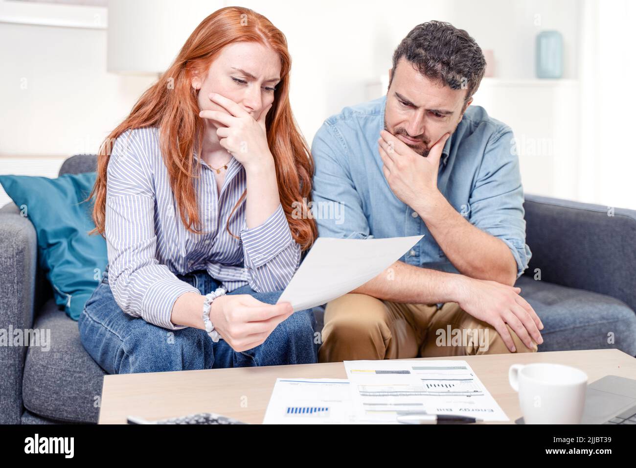 Young caucasian couple having debt problems after home expenses Stock Photo