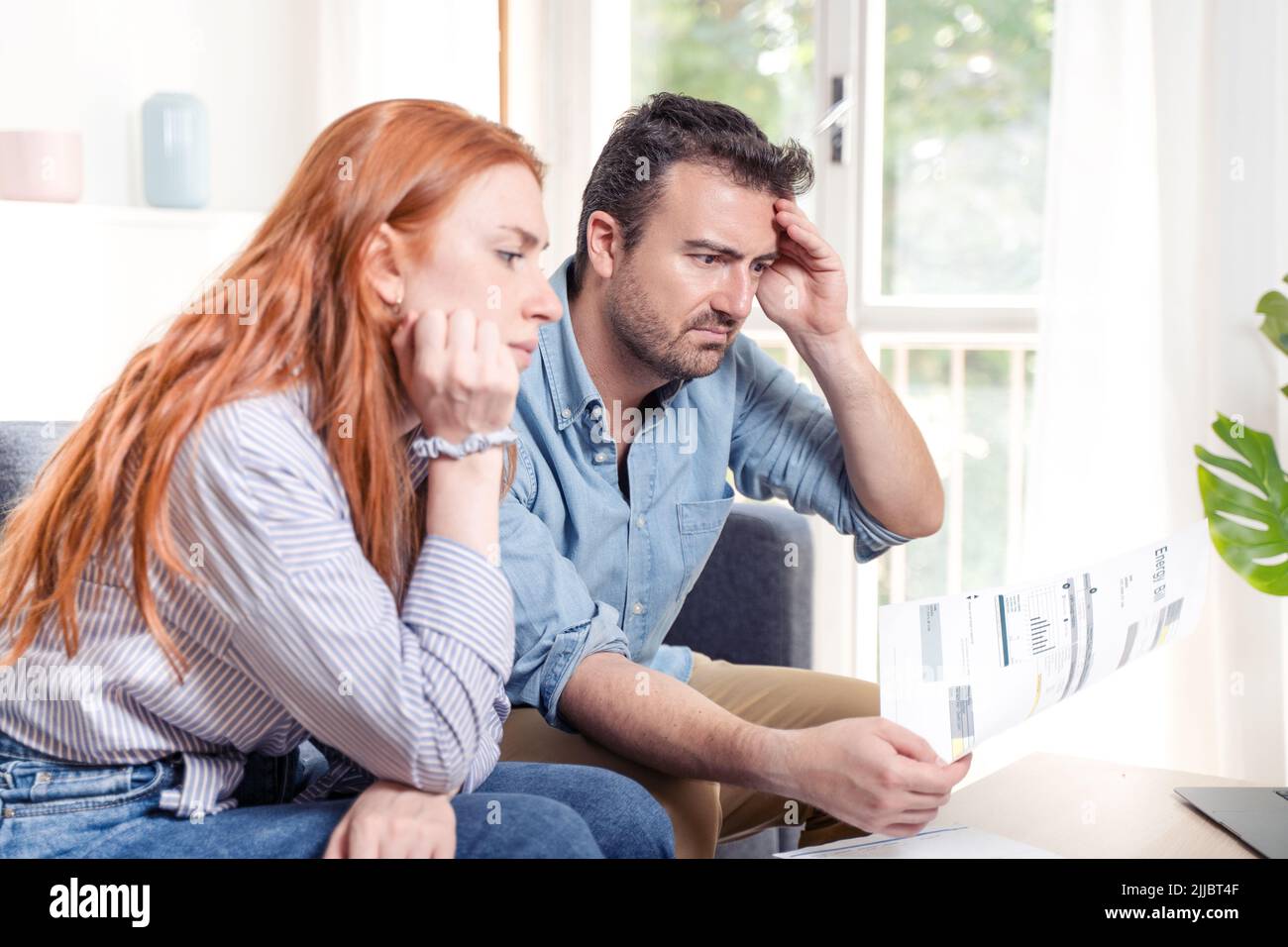 Young caucasian couple having debt problems after home expenses Stock Photo